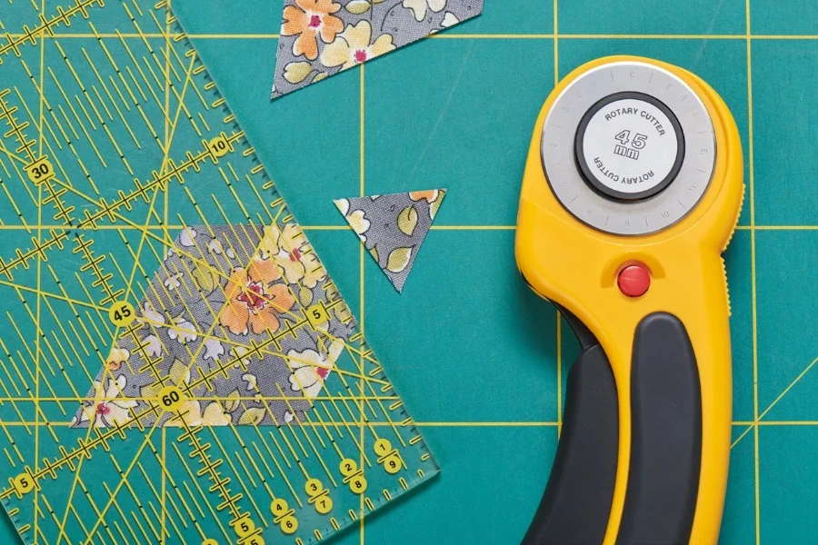 The process of cutting pieces of fabric in the shape of hexagons to create a quilt