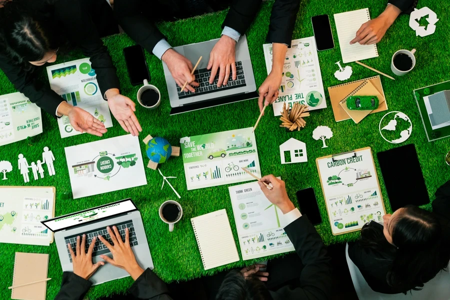 Top view of business people planning to be more sustainable