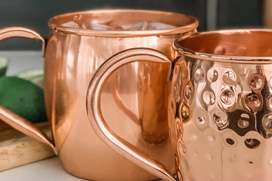 Two beautiful copper mugs on a table