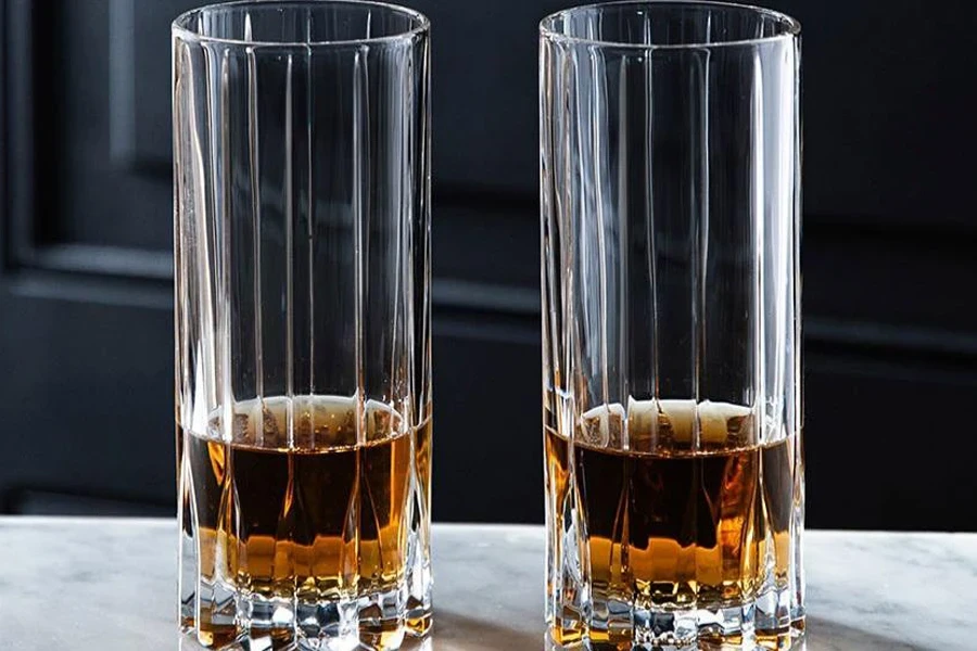 Two highball glasses on a counter