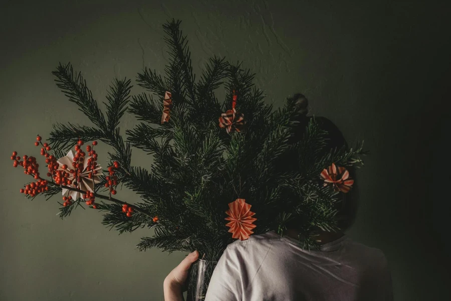 Unrecognizable person with winter bouquet 