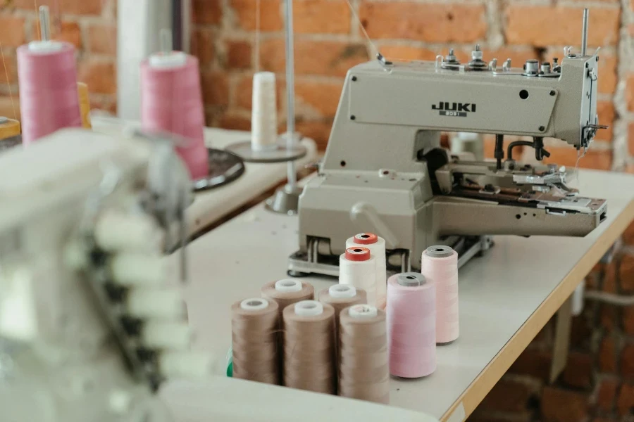 White Sewing Machine With White Plastic Bottles