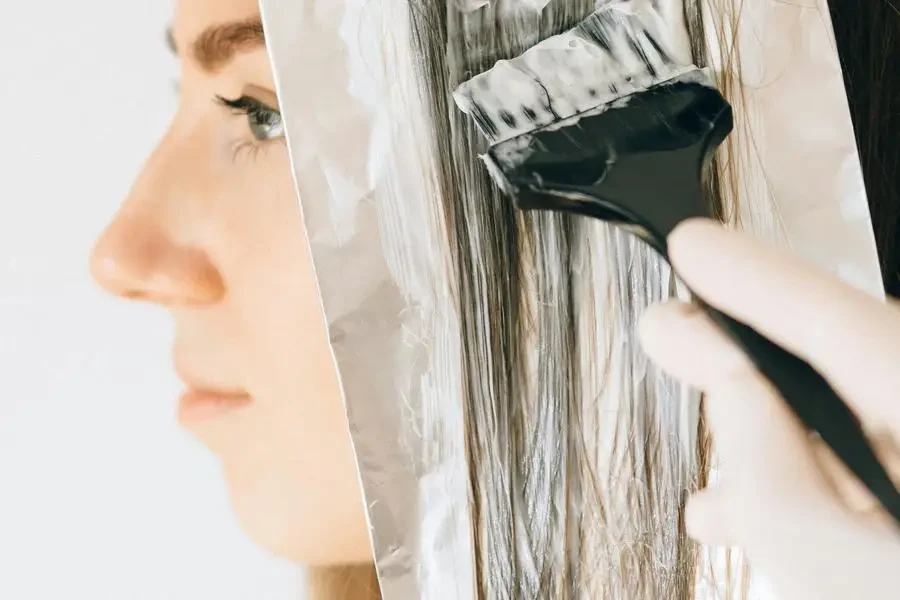 Woman Getting Her Hair Colored by Nataliya Vaitkevich