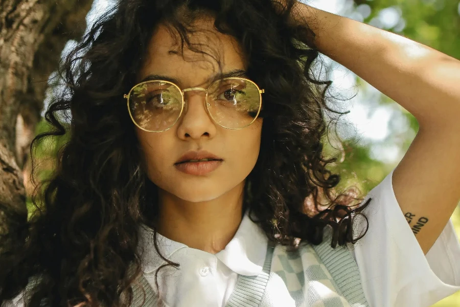 Woman in White Polo Shirt Wearing an Eyeglasses