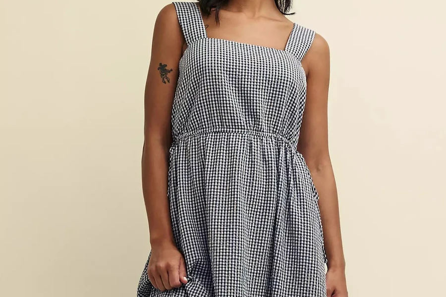 Woman in a dress sporting micro gingham patterns
