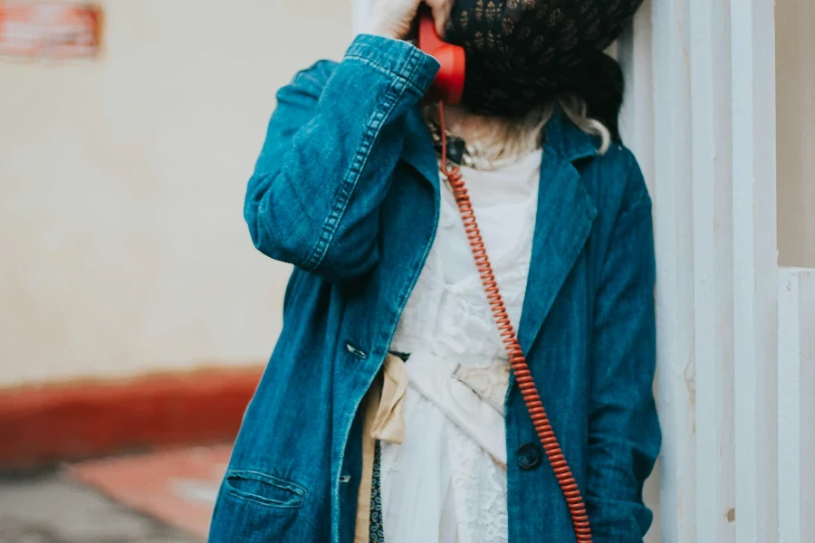 Woman with Covered Face Talking on Phone