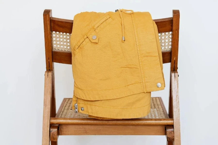 Yellow parka on wooden chair