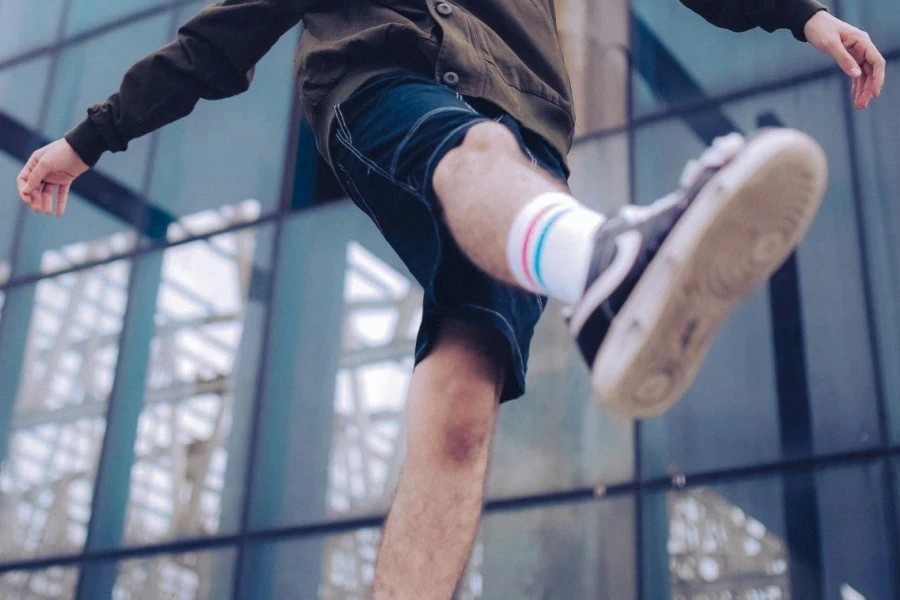 Young Man with Dyed Hair Making Step in Roofless Hall