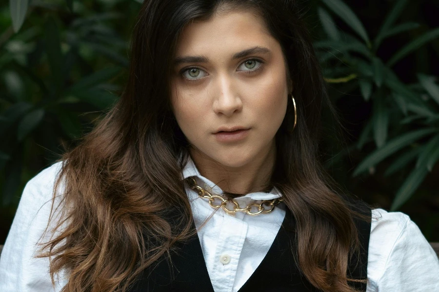 Young Woman in White Blouse and Black Waistcoat