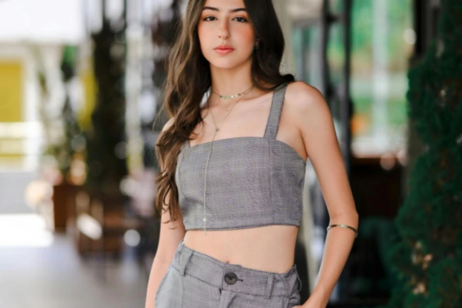 Young Woman in a Gray Crop Top and Pants
