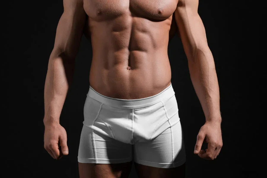 Young man in stylish white underwear