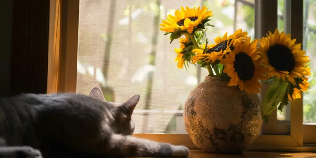 A ceramic vase with sunflowers