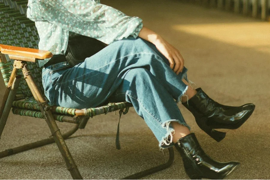 A closeup of baggy jeans and kitten heels