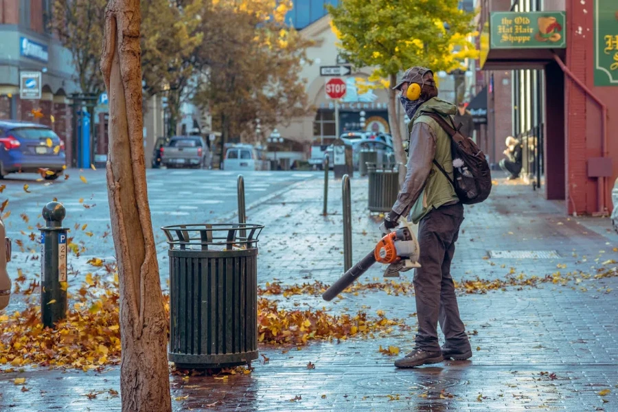 A man holding leaf blower