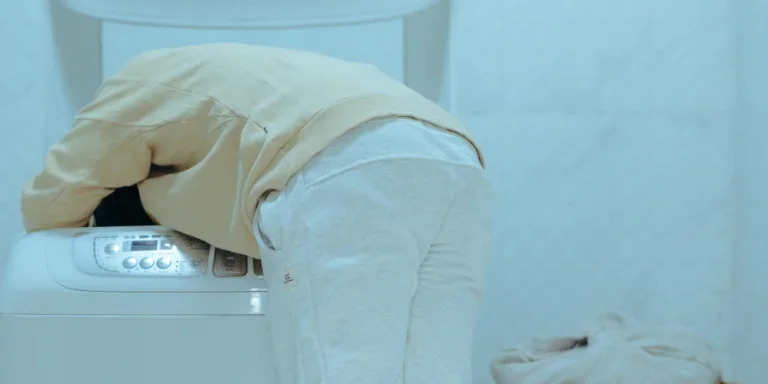 a man is doing laundry