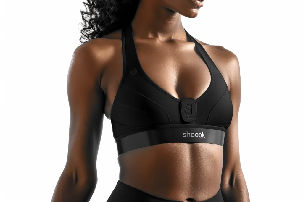 a woman wearing  a black high impact sports bra