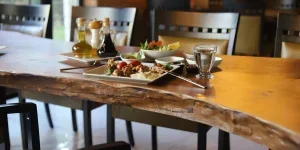 Abstract wooden dining table design and metal chairs