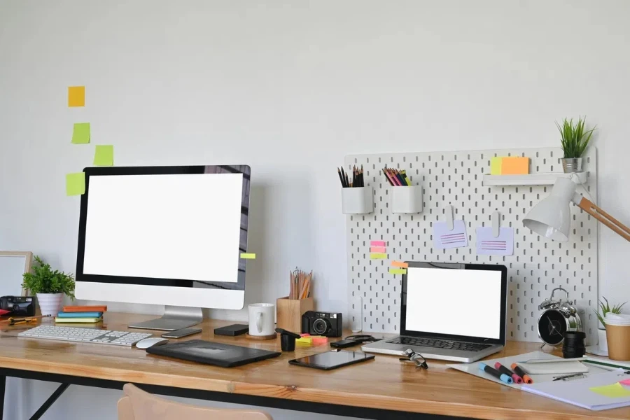 An office desk with a board containing supplies and drawing tools