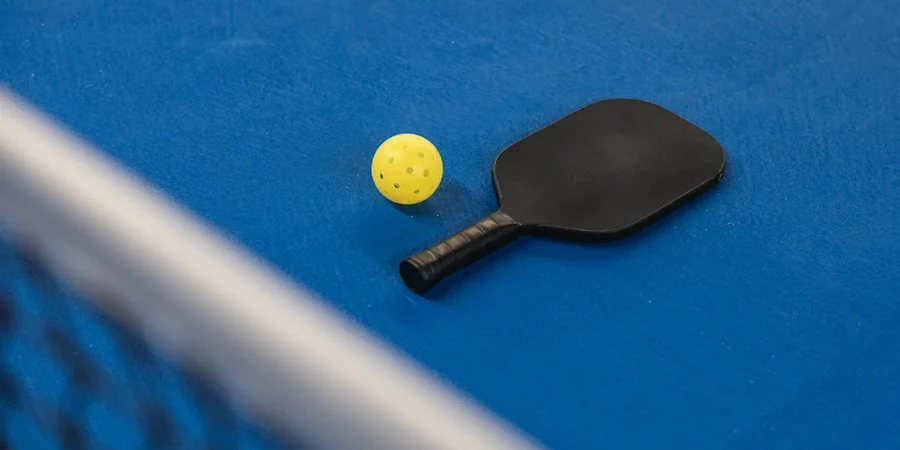 black racket & yellow ball