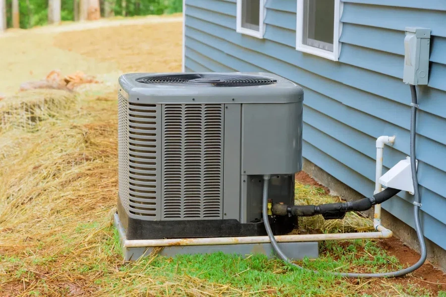 electric air conditioner residential outside near a new house