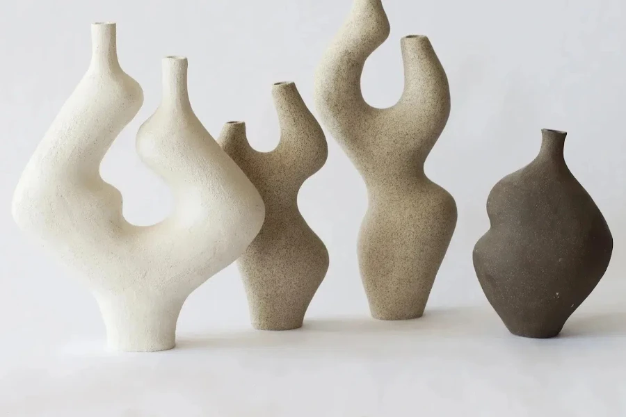 Four unique, statement-making sculptural vases