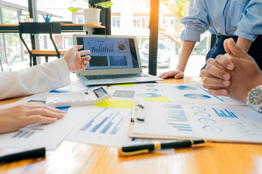 group of businesspeople analyzing reports