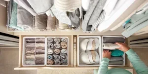 housewife puts container with socks, panties and underwear