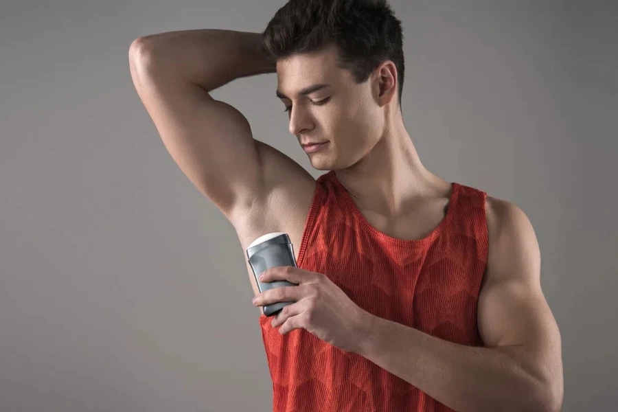 young man in red sleeveless shirt