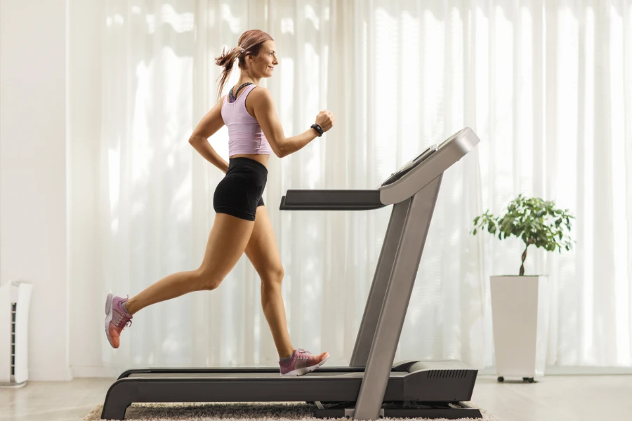 Man running in a gym on a treadmill