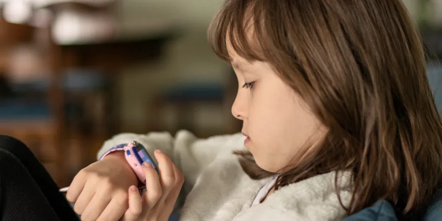 Little girl using smart watch