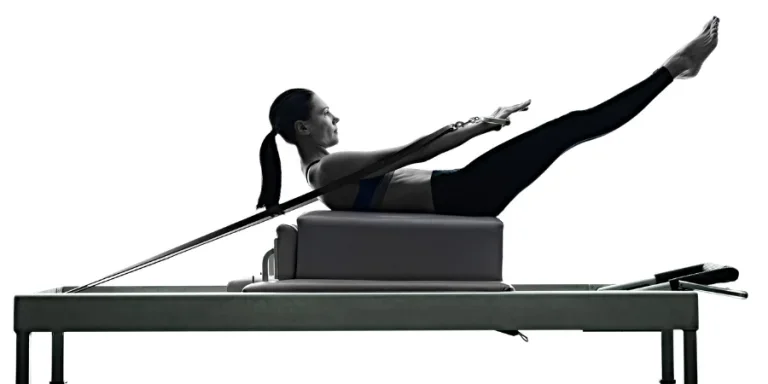 iStock-one caucasian woman exercising pilates reformer exercises fitness