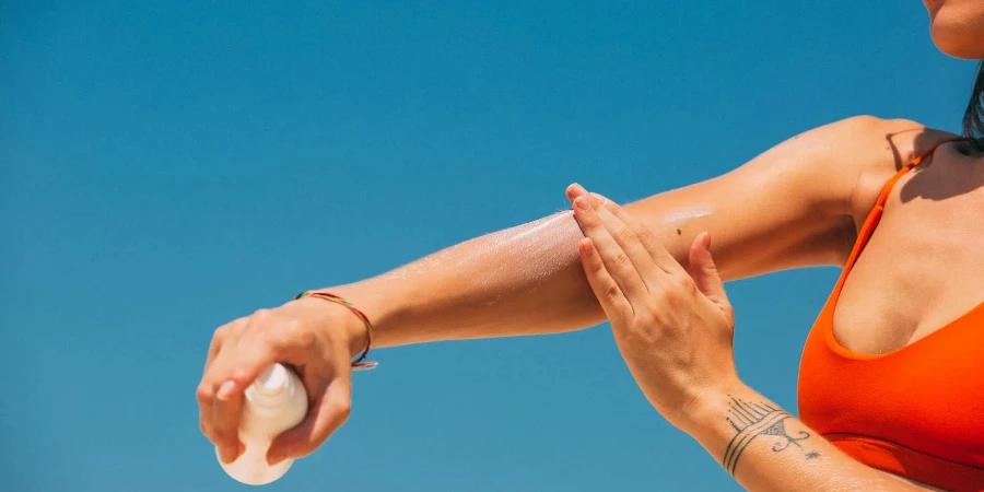 A Woman Applying hair remover on Arm