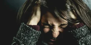 Woman Holding Her Head