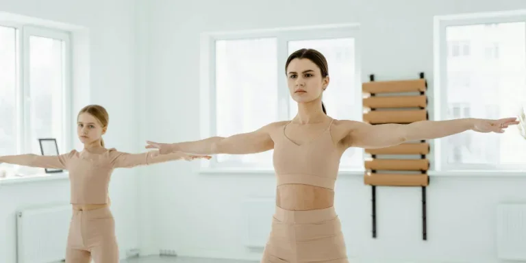 Woman in Brown Bra and Panty Standing on White Floor