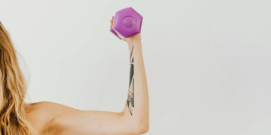 Woman lifting Violet Dumbbell