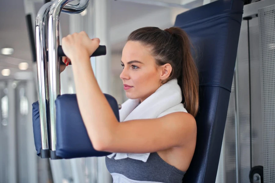 Young determined sportswoman doing exercise