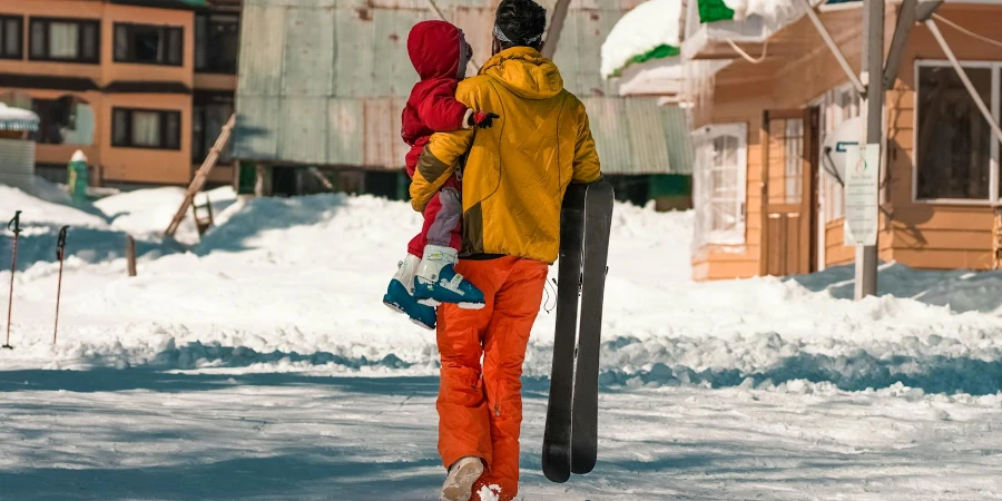 Man with Kid on Snow