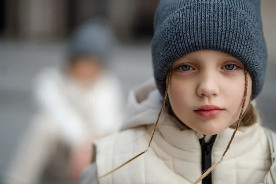 Girl in Vest and Beanie Hat