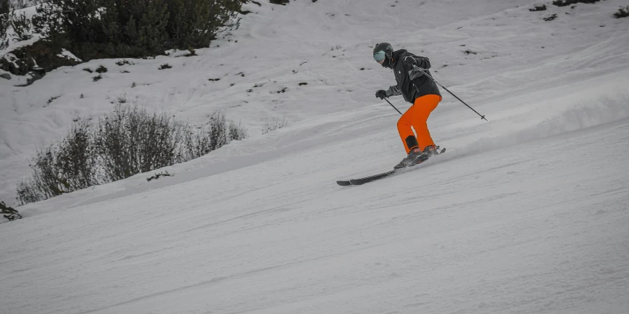 A Skier Skiing Down the Mountain
