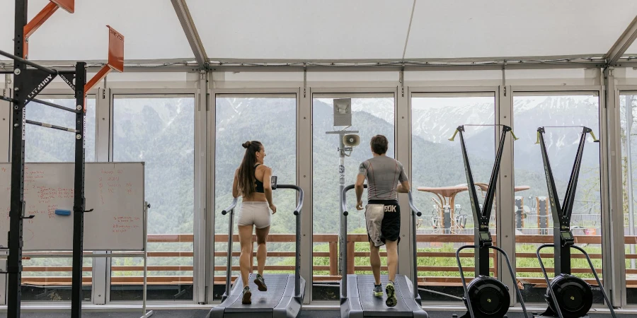 Man and Woman Exercising on a Treadmill