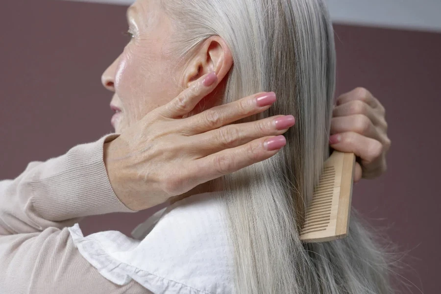 Elderly Woman Combing Her Hair