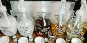Big dispensers of shampoo on shelf