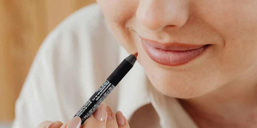 Woman Applying Lip Liner