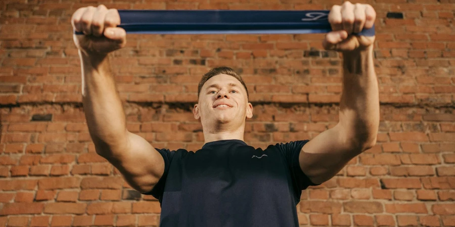 A Man Pulling the Resistance Band