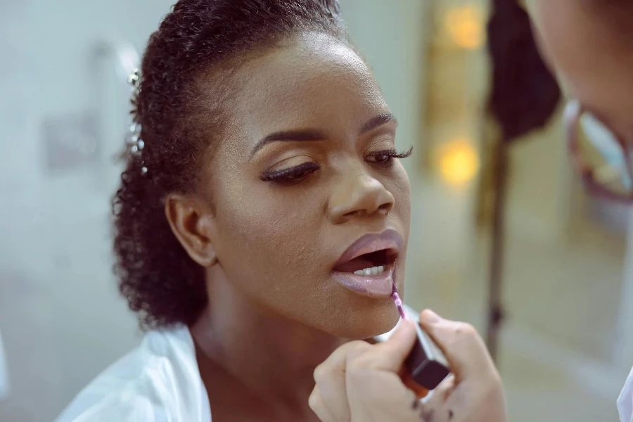 a Woman Getting her Makeup Done