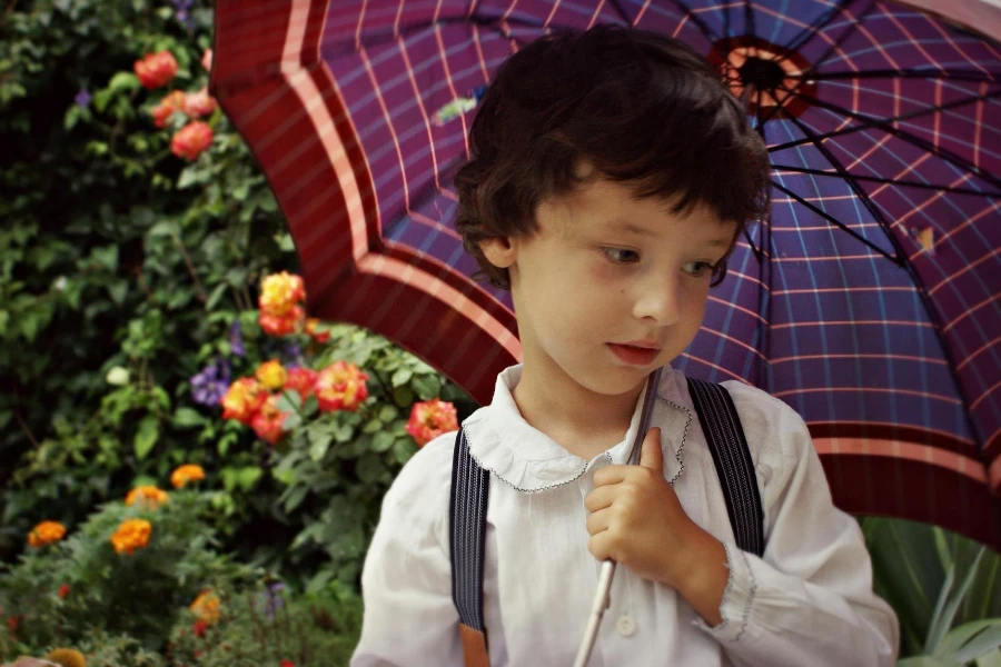 Boy Holding Purple Umbrella