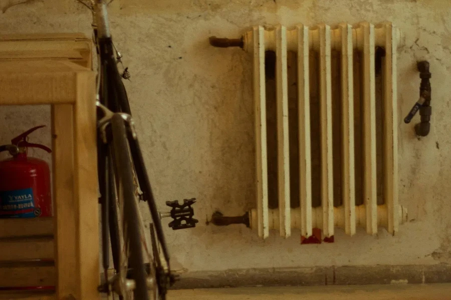 Bicycle next to a Heater in Abandoned Room