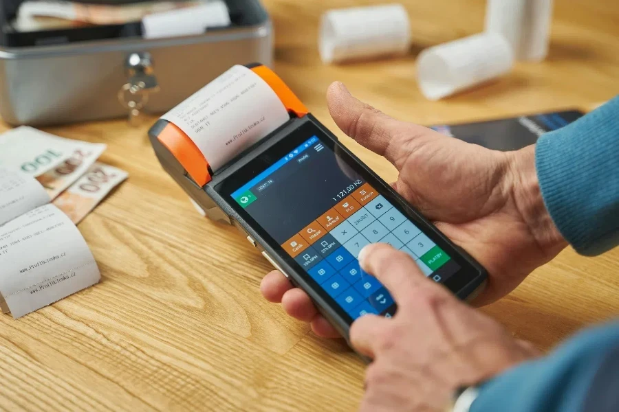 Photo of a Person Printing a Receipt