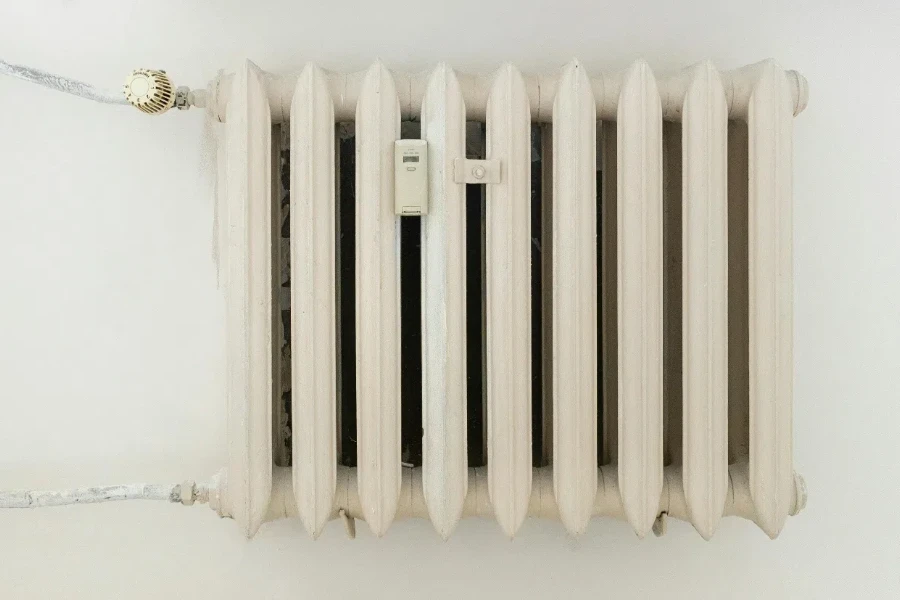 White steel rib radiator in a new bright renovated room