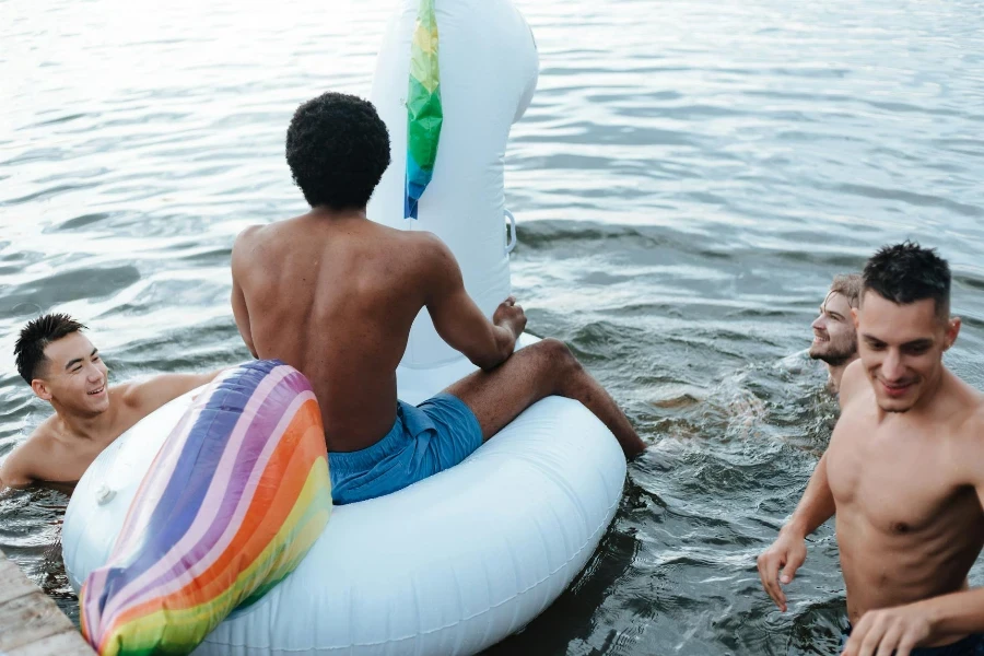 Young men Swimming in Lake